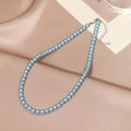 Elegant light blue pearl necklace with silver lobster clasp on champagne silk fabric - 6mm / Blue