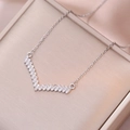 Elegant V-shaped titanium steel necklace featuring pavé-set zircons on champagne satin - Steel Color (X3118)