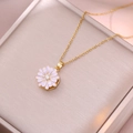 Elegant rotating daisy pendant necklace in gold finish with pink enamel and zircon stone - Rotating Daisy Necklace (X3169)