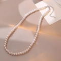 Elegant pearl necklace on silk background with silver lobster clasp and extension chain - 8mm Pearl Diameter / 8MM Pink Gradient Pearl Style