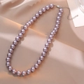 Elegant lavender pearl necklace with silver lobster clasp on champagne satin background - 10mm / Purple