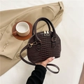 Dark brown crocodile pattern shell handbag with gold hardware and top handles - Brown