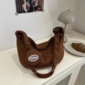 Brown corduroy half-moon crossbody bag with round coin purse on a minimalist white surface - Brown