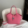 Pink minimalist faux leather bucket bag with top handles and adjustable shoulder strap - Pink