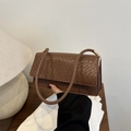 Elegant brown woven shoulder bag with flap closure in a minimalist rectangular shape - Tan