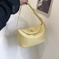 Sac seau jaune pâle en cuir grainé avec fermoir rotatif doré et bandoulière ajustable - Jaune