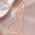 Detail of natural freshwater pearl necklace with S925 silver heart clasp on silk fabric - High Luster White Style (YX0068) / Approx. 5.5mm Pearl