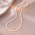 Close-up of S925 sterling silver lobster clasp and heart tag on a pearl necklace - Warm White Gold Style (YX0065) / Approx. 5.0mm Pearl