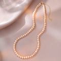 Close-up of S925 silver clasp and heart pendant on natural pink freshwater pearl necklace - Pale Orange Pink Style (YX0064) / Approx. 5.0mm Pearl