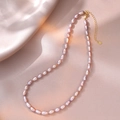 Detailed macro of S925 sterling silver lobster clasp with heart charm on pearl necklace - Lavender Purple Style (YX0063) / Approx. 5.3mm Pearl