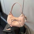 Pink crescent hobo bag with bow detail and adjustable strap for elegant daily commute - Pink Without Pendant
