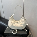 Chic beige dumpling hobo bag with a minimalist bow detail and dual shoulder straps - White