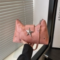 Pink PU leather shoulder bag featuring a large metal star buckle and star rivets - Pink