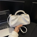 Elegant white pleated cloud bag featuring a large pearl handle and slim shoulder strap - White