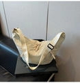 Chic beige nylon crescent bag featuring a pleated texture and adjustable wide shoulder strap - White
