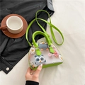 Floral mini shell bag with owl embroidery and green leather handles in a flat lay view - Owl Style / Small