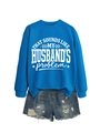 Flat lay of blue crewneck sweatshirt with slogan and distressed denim shorts ensemble - Lake Blue (White Font)