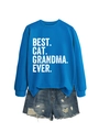 Close-up of blue sweatshirt with BEST CAT GRANDMA EVER text and distressed denim shorts - Lake Blue (White Print)