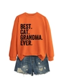 Flat lay of orange crewneck sweatshirt with Best Cat Grandma Ever print and denim shorts - Orange (Black Print)