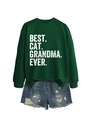 Flat lay of a dark green sweatshirt with Best Cat Grandma Ever print and denim shorts - Dark Green (White Print)