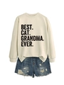 Detail view of the Best Cat Grandma Ever sweatshirt paired with ripped denim shorts - Sand (Black Print)