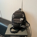 Black quilted backpack with embroidered bow patterns and a sleek faux leather strap - No Pendant / Small / Black