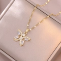 Detailed close-up of golden butterfly pendant necklace with inlaid sparkling zircon crystals - Butterfly Gold Color Necklace (X3558)
