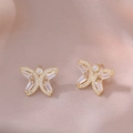 Detail of golden butterfly stud earrings featuring micro-pave crystals on satin fabric - Butterfly Gold Color Earrings (E1109)