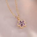 Exquisite gold necklace featuring a purple floral pendant with zircons on champagne satin - Purple Flower Pendant Gold Chain (X3618)