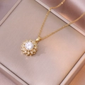 Elegante collar de titanio dorado con colgante de flor giratoria de circón en caja de regalo - Collar De Flor Giratoria Dorado / Dorado