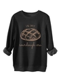 Détail des poignets côtelés et du motif Sourdough Era sur un sweat-shirt noir - Noir