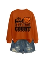 Detail of orange sweatshirt with My heart is on that COURT print and ripped denim shorts - S / Tops / Orange