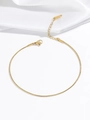 Detailed close-up of a gold snake bone chain necklace with lobster clasp and steel tag - Bracelet