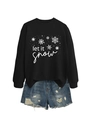 Detail of Let It Snow snowflake sweatshirt paired with frayed denim shorts in a casual set - Black (White Print)