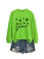 Detailed view of neon green 'Let It Snow' crewneck sweatshirt with snowflake prints - Fluorescent Green (Black Print)