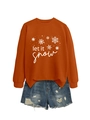 Flat lay of an orange crewneck sweatshirt with Let It Snow print and ripped denim shorts - Burnt Orange (White Print)