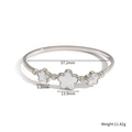Detalle de brazalete de acero con flores de nácar y piedras con medidas de dimensiones - Brazalete de Flores de Color Acero