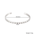 Detail shot of a 4mm silver geometric cuff bracelet with heart stones and 65.8mm inner diameter - Silver Style (STB25116-ST)