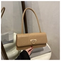 Detail of beige faux crocodile leather shoulder bag with golden horseshoe metal buckle - Khaki