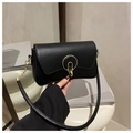 Detail of black matte leather shoulder bag with circular gold metal buckle closure - Black