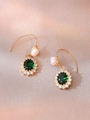 Detail of emerald green gemstone earrings with white pearls on elegant satin fabric - Dark Green Gemstone Pearl Earrings (E0907)