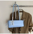 Detail of light blue PU leather bag featuring lace bow and pearl heart pendant - Blue with Charm
