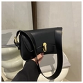 Detailed view of black faux leather shoulder bag with elegant gold oval metal buckle clasp - Black