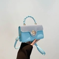 Light blue contrast crossbody bag with grey flap and floral metal lock detail - Blue