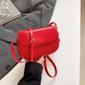 Minimalist red faux leather saddle bag with adjustable strap and gold buckle detail - Red