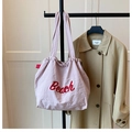 Pink canvas tote bag with red Beach lettering and drawstring closure for students - Pink