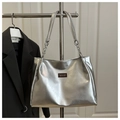 Silver metallic tote bag showing detailed PU leather texture and chain strap on a hanger - No Pendant / Silver