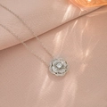 Elegant silver camellia flower necklace with sparkling zircon petals on pink fabric - Silver Camellia Style (X3715)