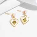Close-up of heart-shaped pearl earrings with gold four-leaf clover motif and silk detail - Heart Freshwater Pearl Earrings
