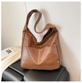 Detail of a brown PU leather Hobo shoulder bag featuring a Fashion & Bags rectangle label - Khaki